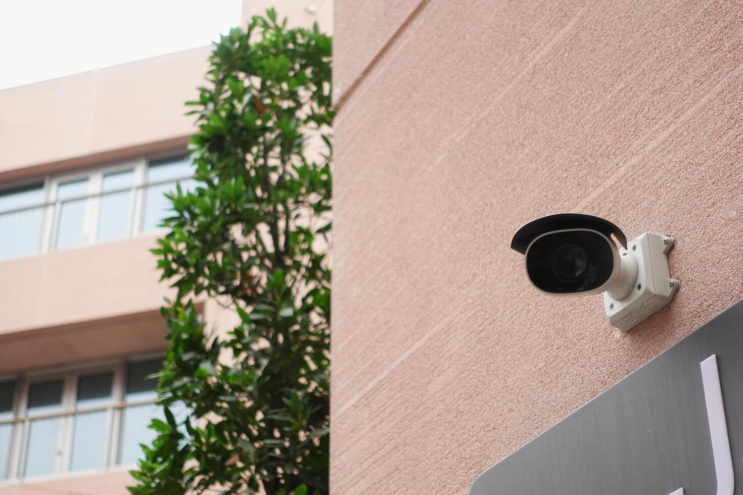 CCTV security camera operating outdoor photo