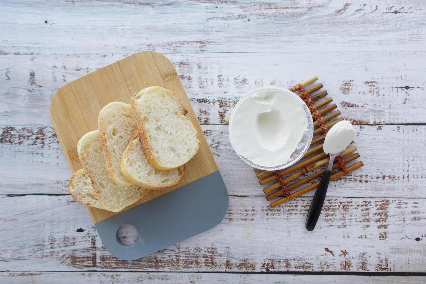 low fact cheese cream and bread on table photo