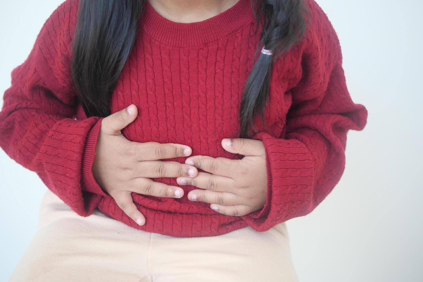 child suffering stomach pain close up. photo