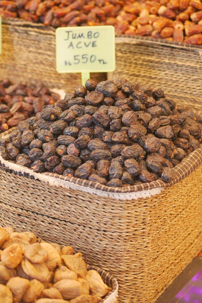 many date fruits display for sale at local market photo