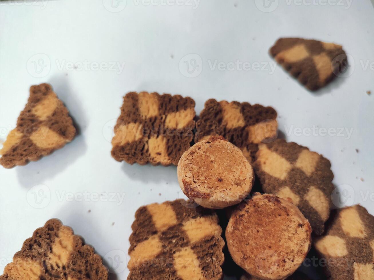 Piece of dark chocolate chip cookie isolated on white background from delicious bakery homemade organic sweet dessert biscuit photo