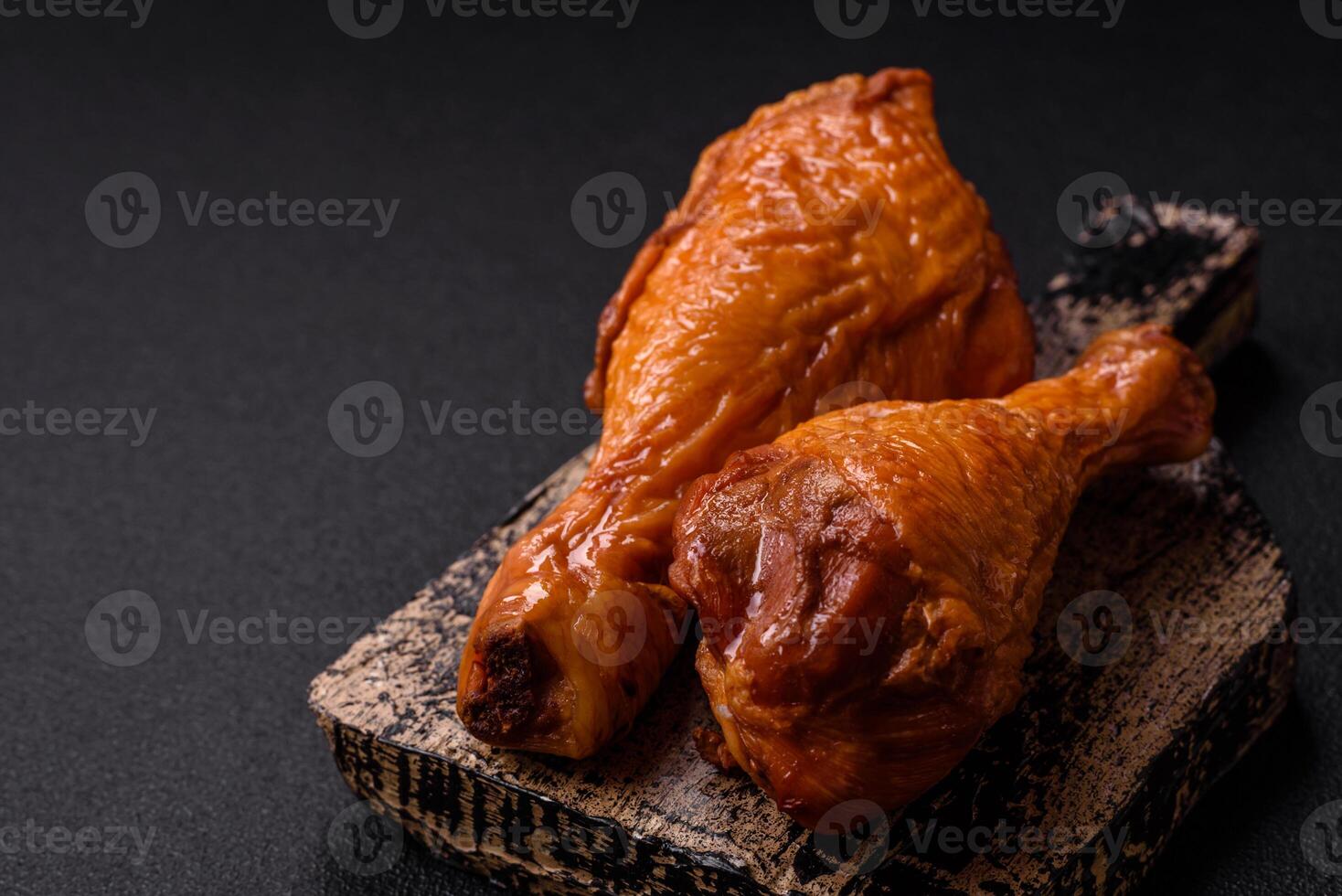 Delicious chicken legs baked on the grill with salt, spices and herbs photo