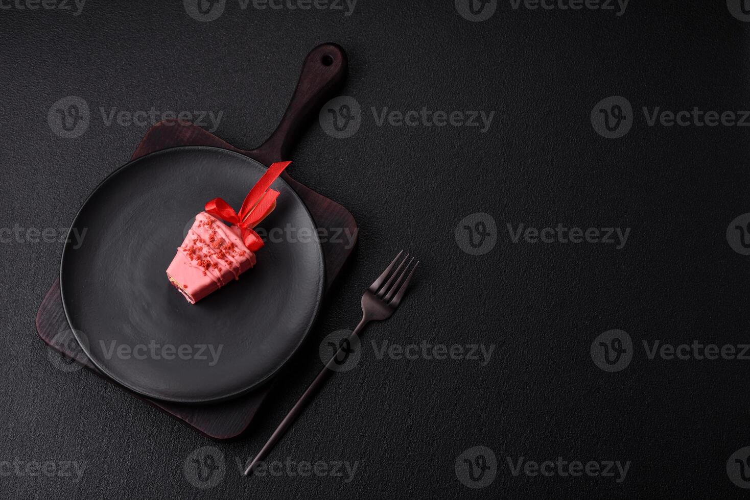 Delicious sweet cheesecake with fruits covered with icing with a wooden stick photo