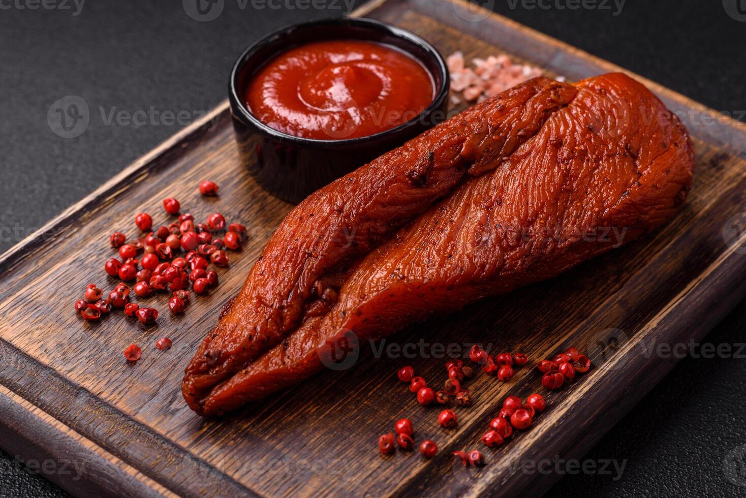 Delicious smoked meat chicken breast with salt, spices and herbs photo