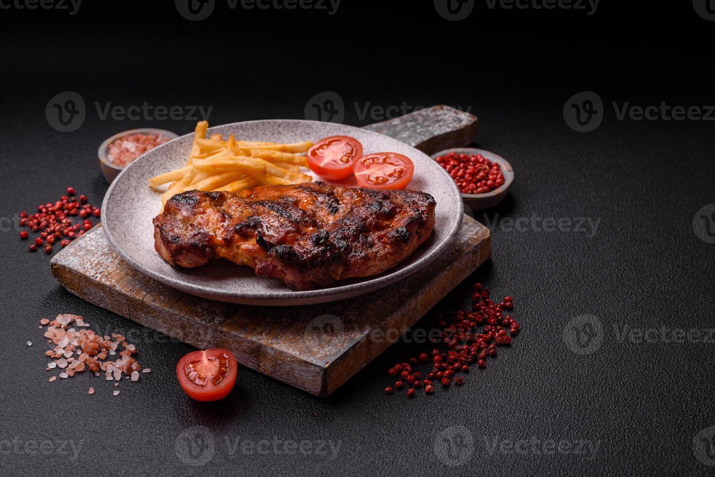 Fresh juicy delicious beef steak on a dark background photo
