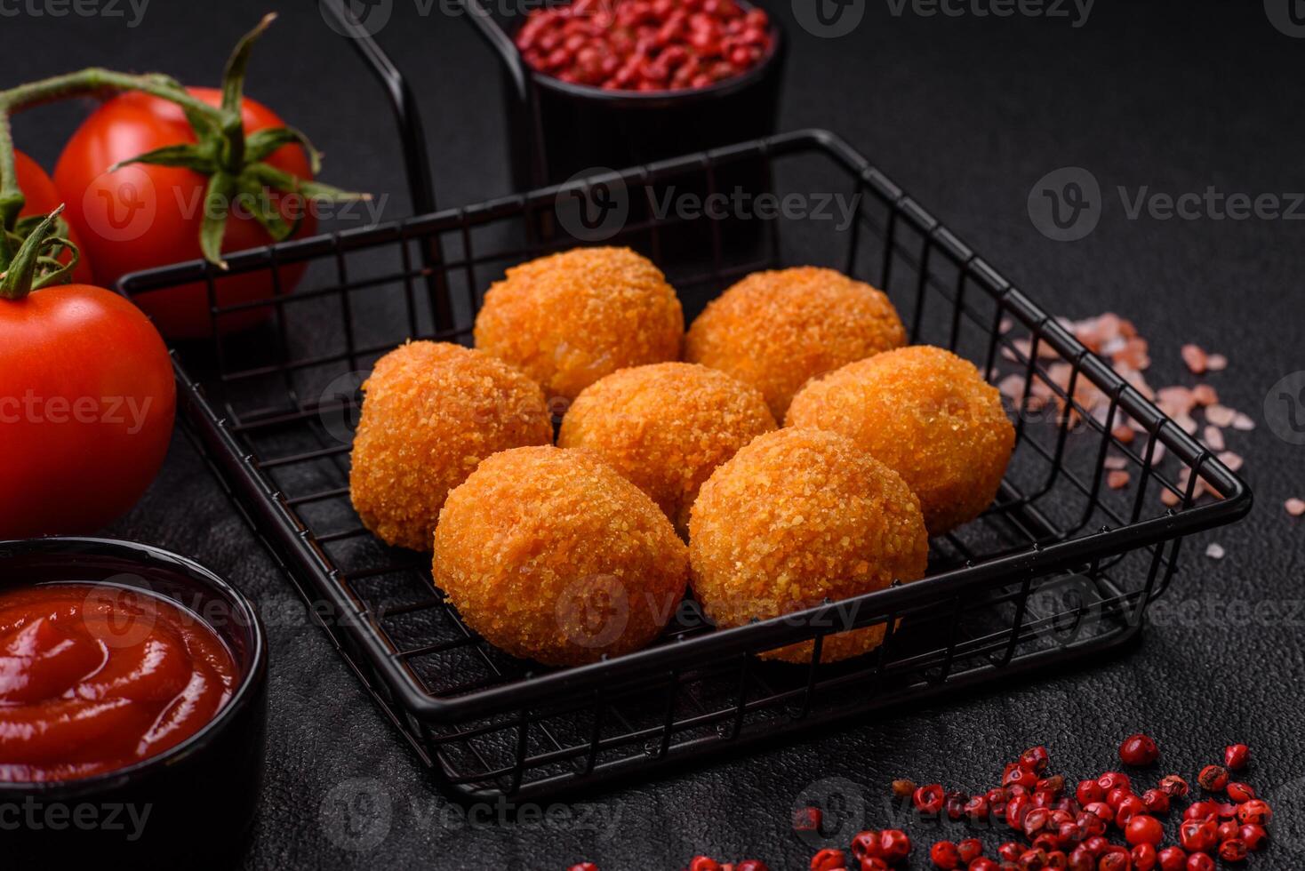 Delicious  balls of mozzarella and parmesan cheese with salt and spices photo