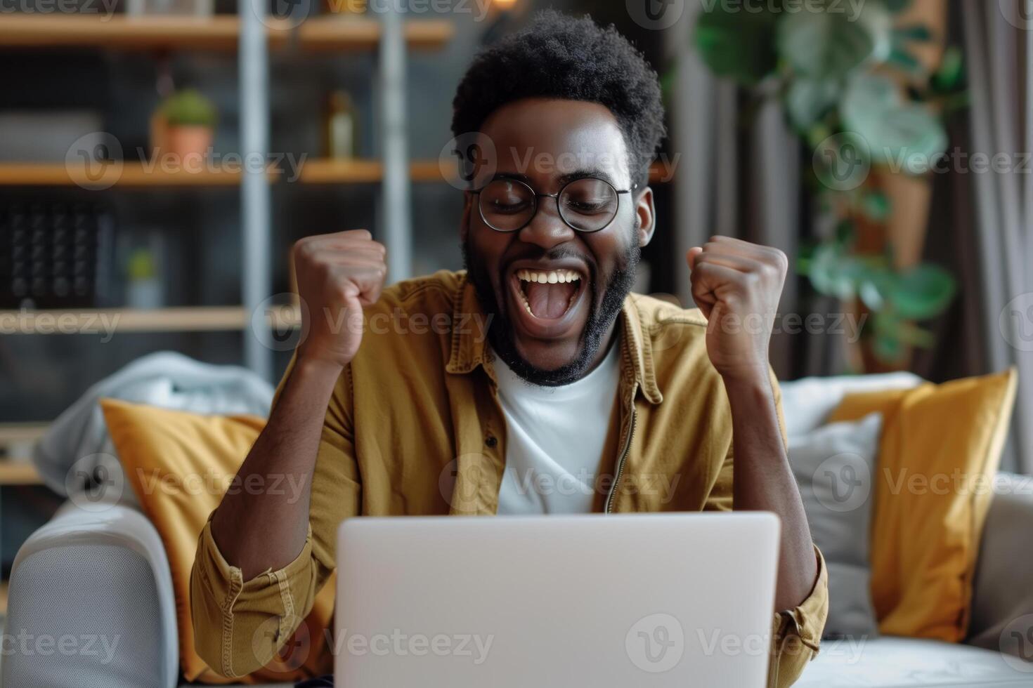 AI generated A joyful African American man is sitting on a comfortable sofa in the living room and is focused on the screen of his laptop. Victory, winning concept photo