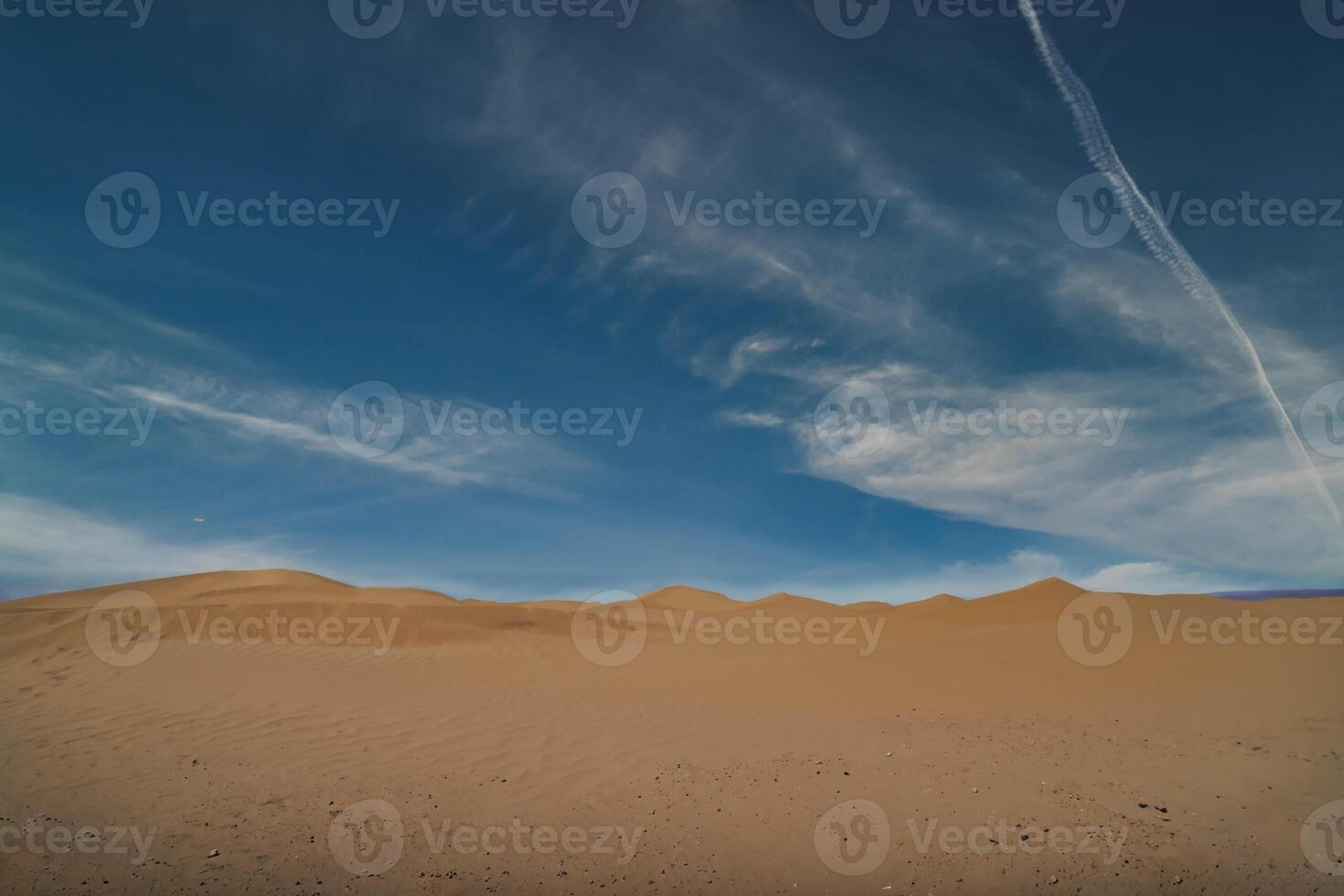 A panoramic sand dune of sahara desert at Mhamid el Ghizlane in Morocco wide shot photo