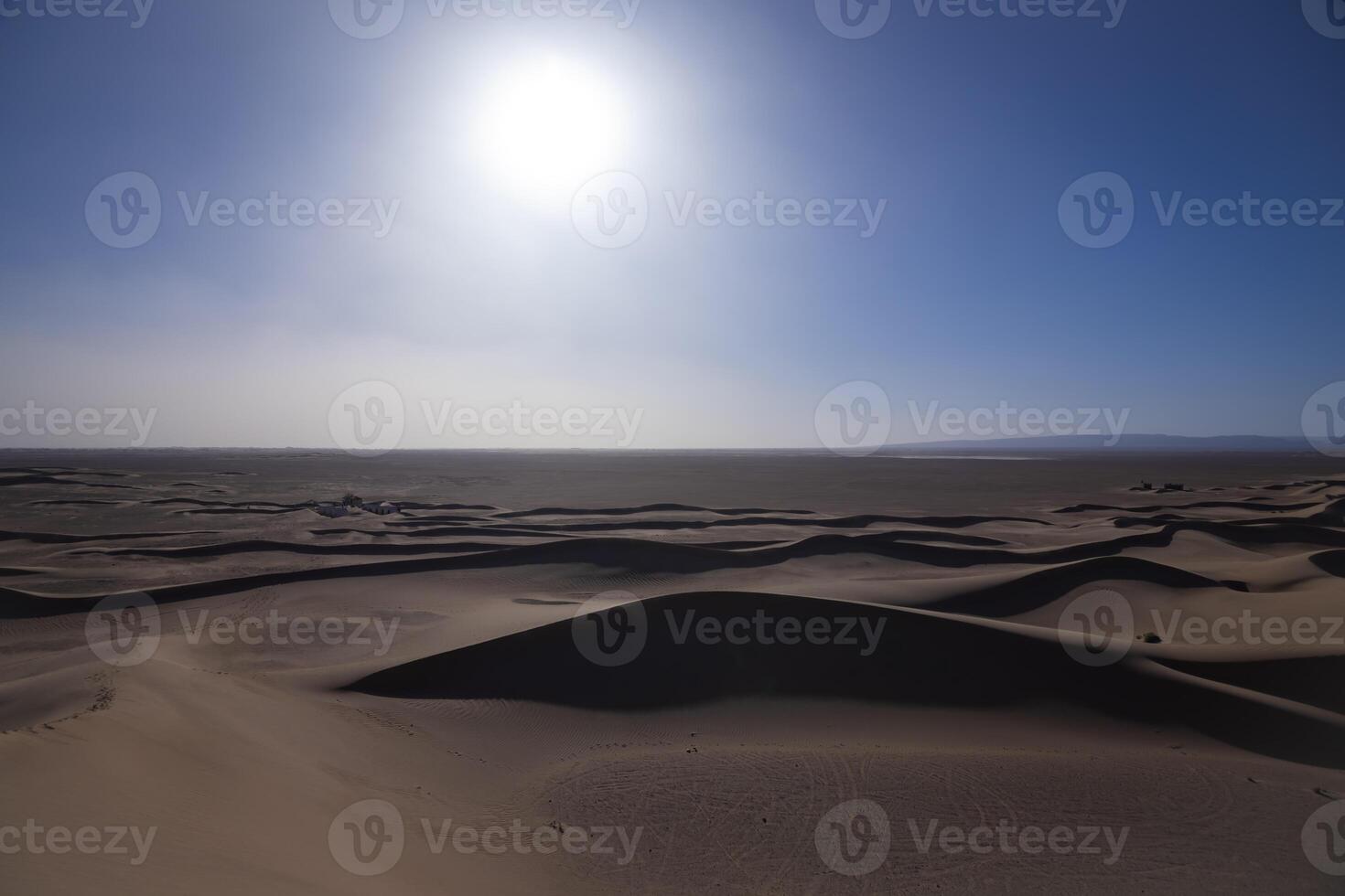 A panoramic sand dune of sahara desert at Mhamid el Ghizlane in Morocco wide shot photo