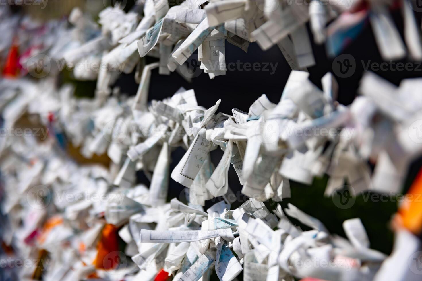 A fortune telling slip at Tomioka Shrine closeup photo