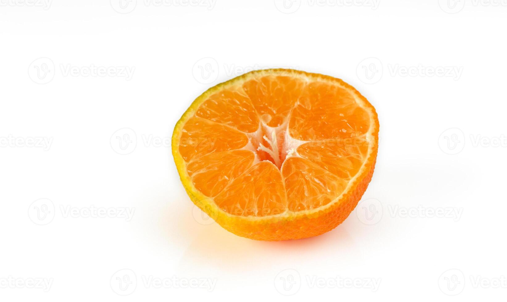 half of tangerine on white background 1 photo