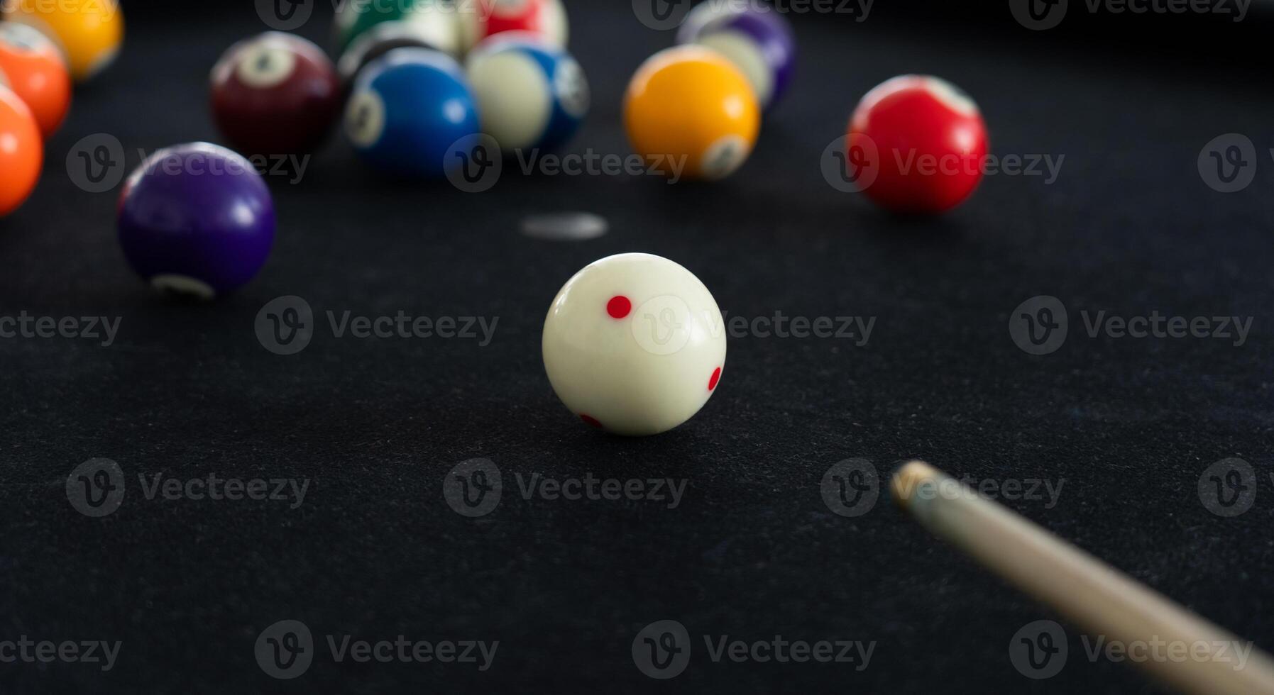 Close up View of Man Playing Pool Table photo