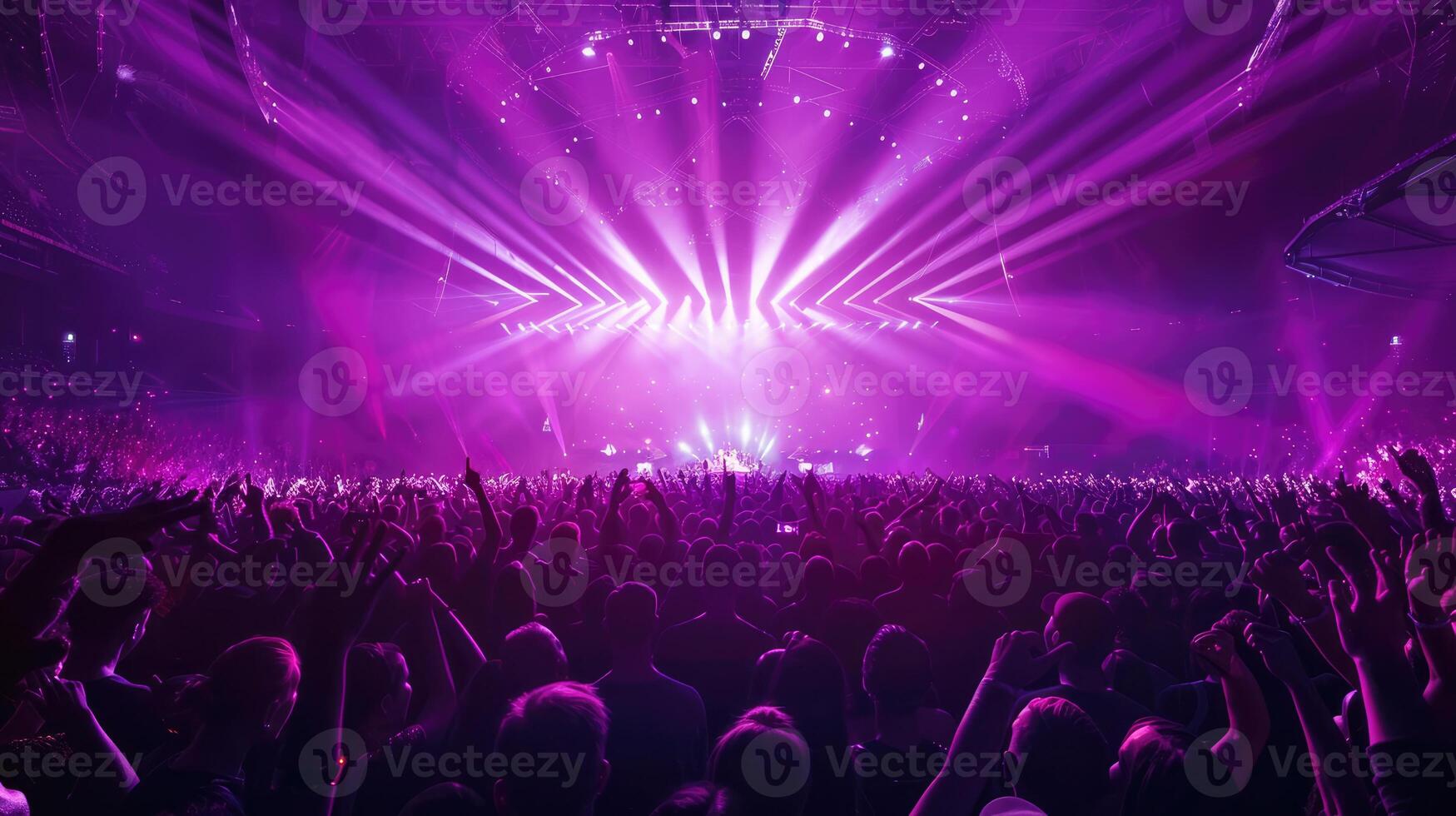 Arena or Stadium concert with center stage, illuminated with purple lasers photo
