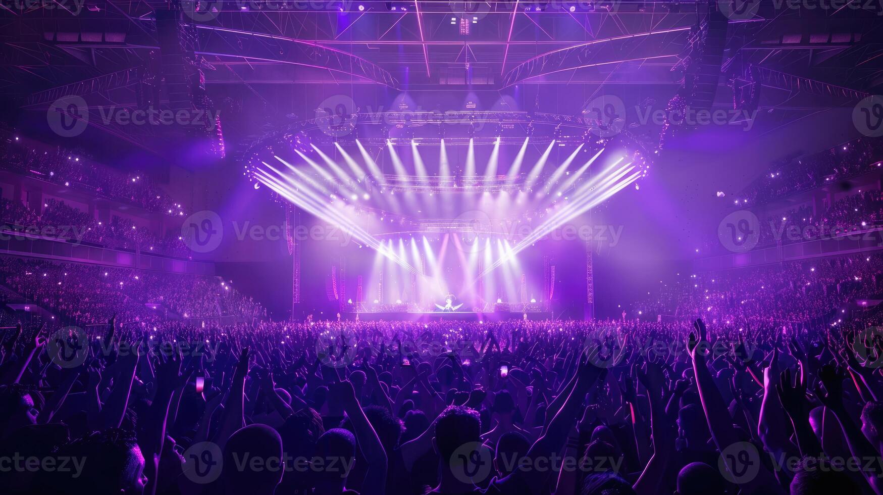 Arena or Stadium concert with center stage, illuminated with purple lasers photo