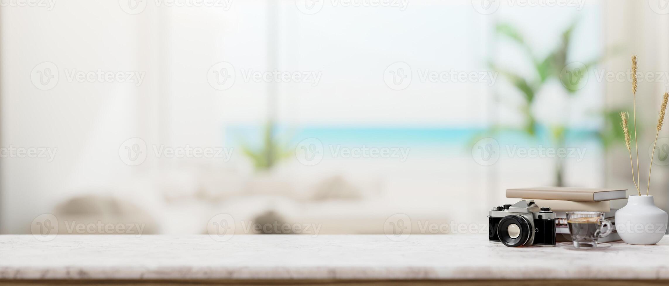 A luxurious marble tabletop against the backdrop of a blurred modern white living room beach house. photo