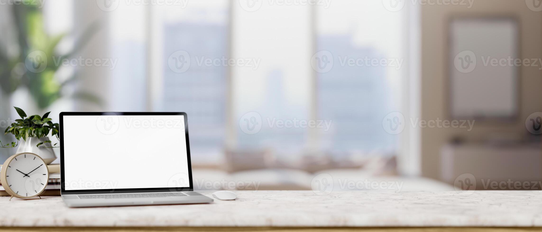 A luxurious marble table is adorned with a white-screen laptop computer in a modern living room. photo