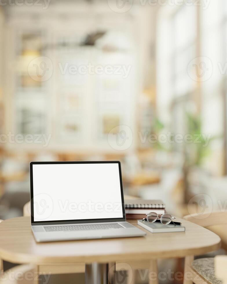 A modern, minimalist coffee shop features a white screen laptop computer mockup on a wooden table. photo