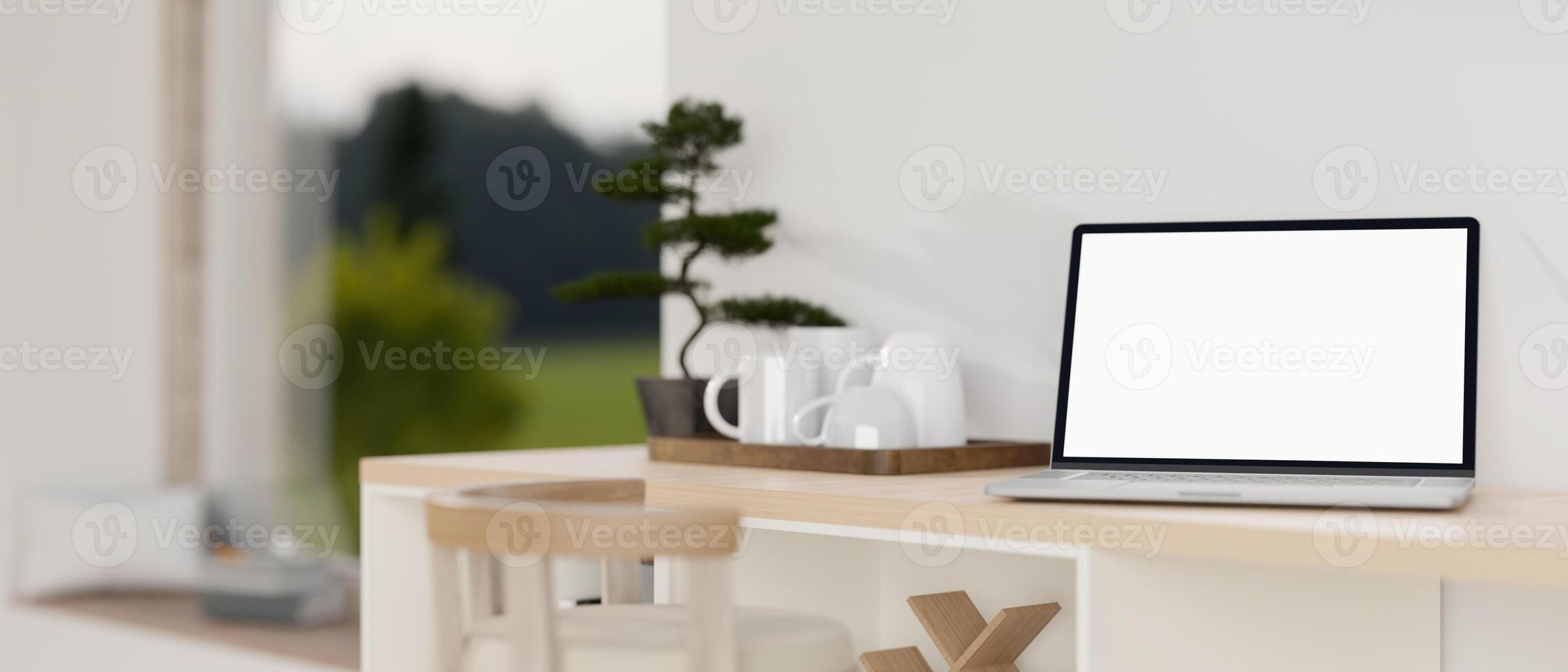 A white-screen laptop computer mockup on a wooden cabinet countertop in a modern white room. photo