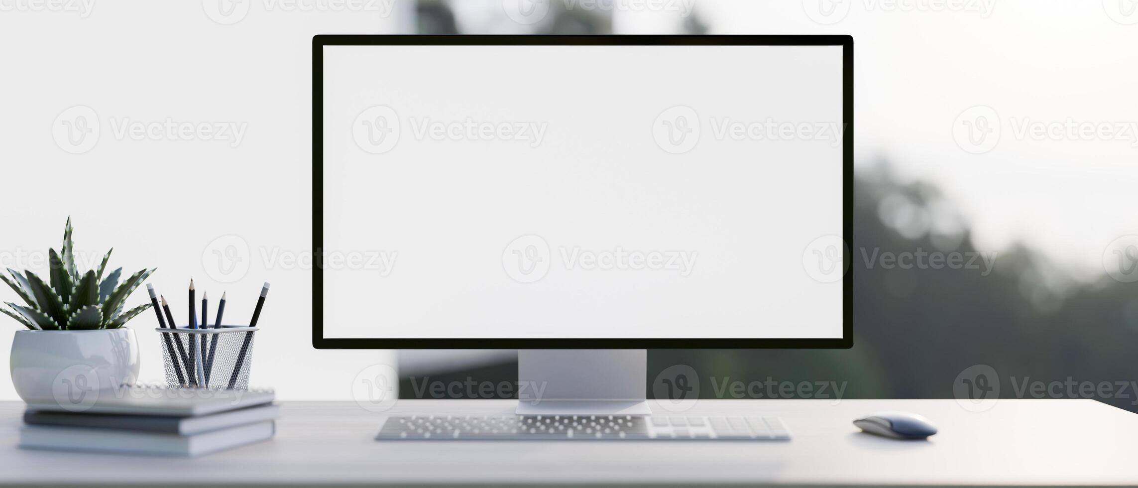 A close-up image of a PC computer white-screen mockup and accessories on a white desk photo