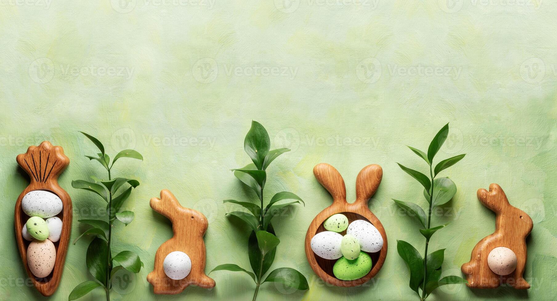 Row of wooden plates as bunnies and carrot, Easter eggs, green twigs on green yellow. Copy space. photo