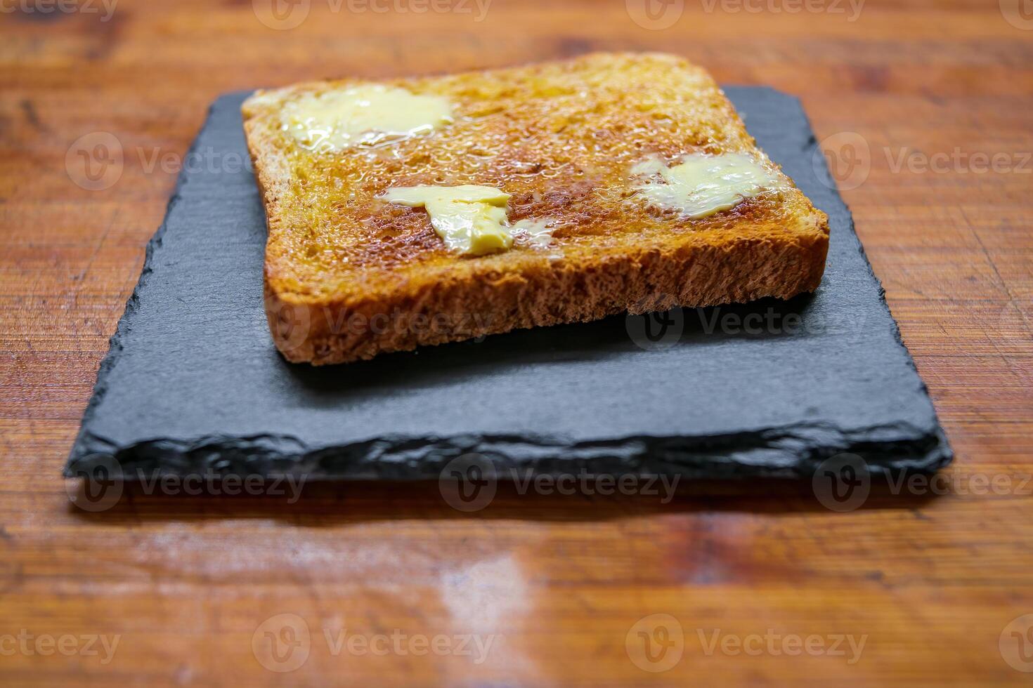 a delicious fresh bread with herb cream for the breakfast photo