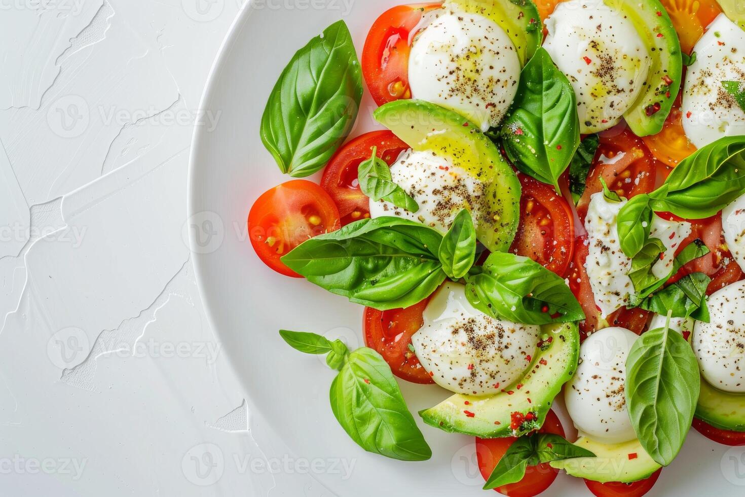 Salad with tomatoes, mozzarella, basil and allspice spices. Top view photo