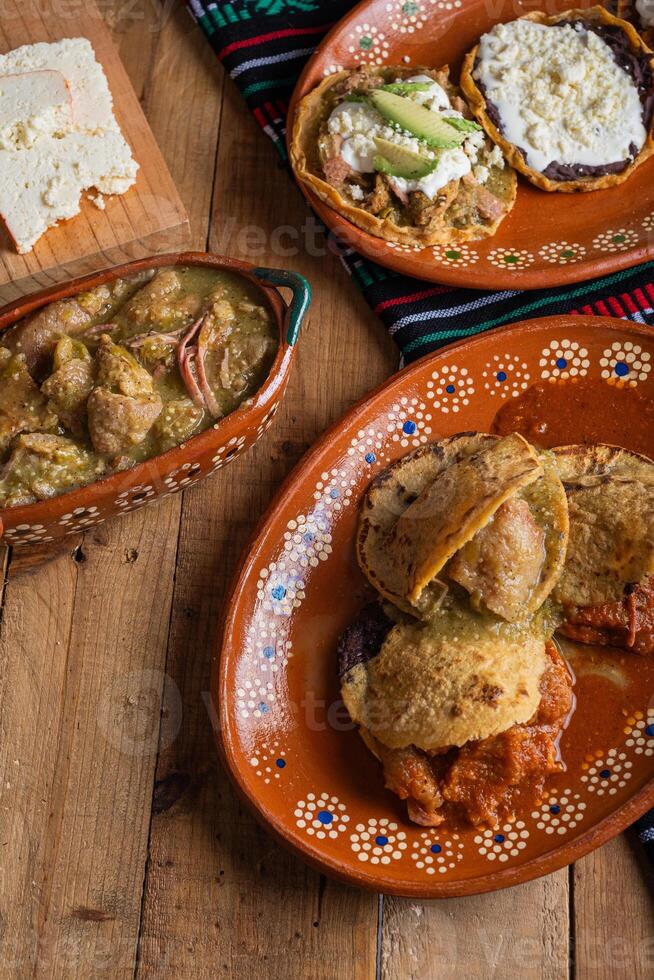 Gorditas de chicharron in green sauce and red sauce. Mexican food. photo