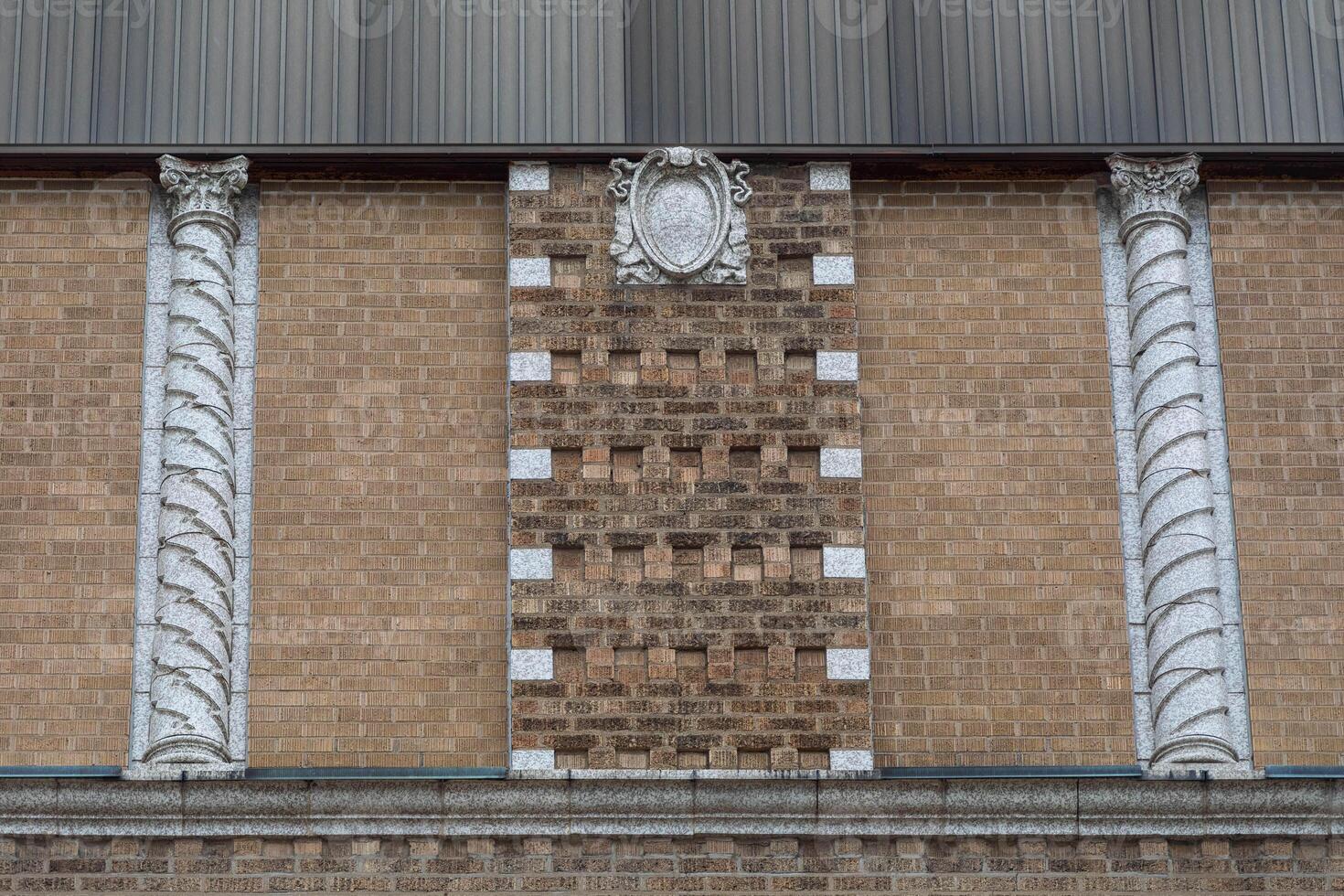 some decorative brick on the side of an old building photo