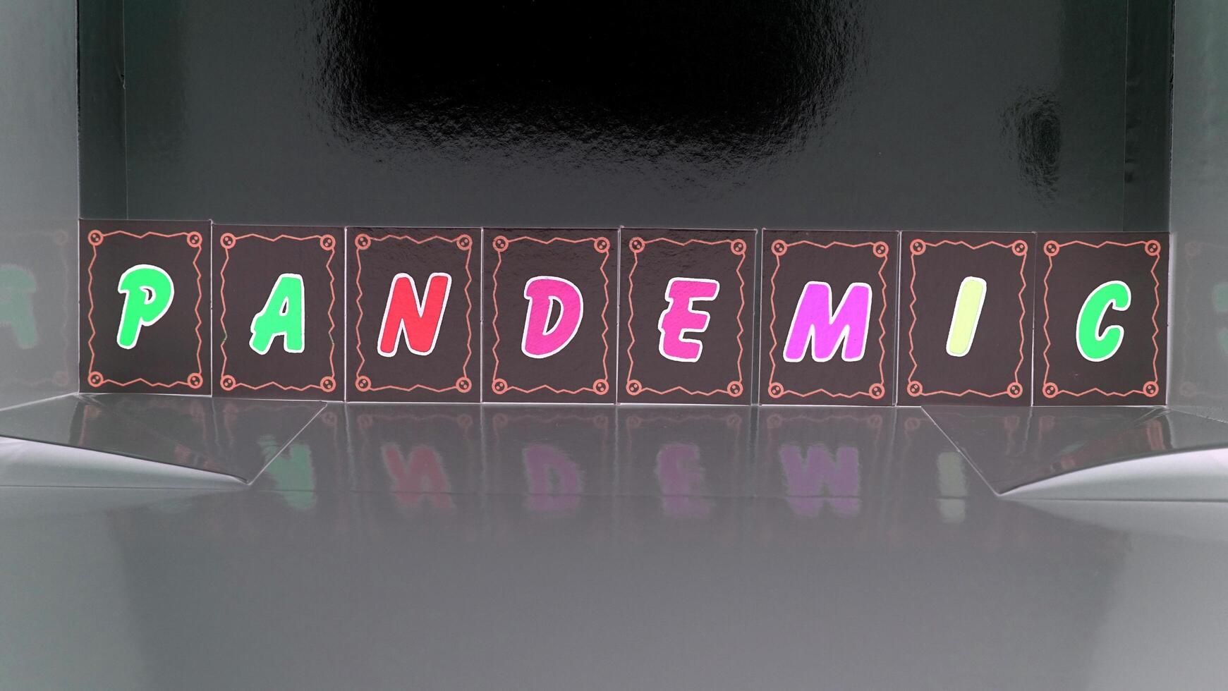 pandemic composed with colored cardboard letters photo