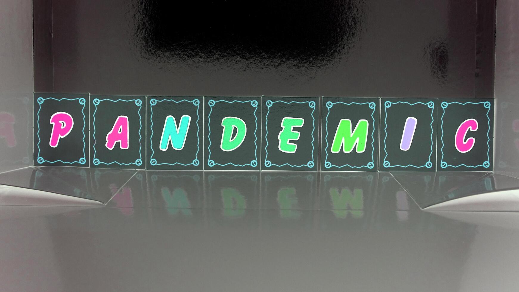 pandemic composed with colored cardboard letters photo