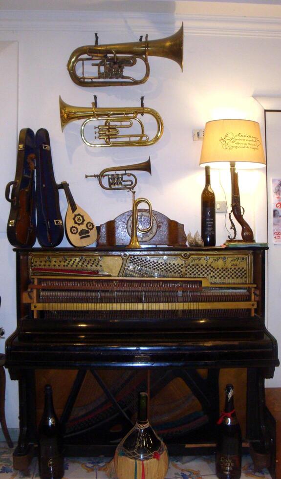 naples, Italy, Europe - August 15, 2019 musical instruments on the wall photo