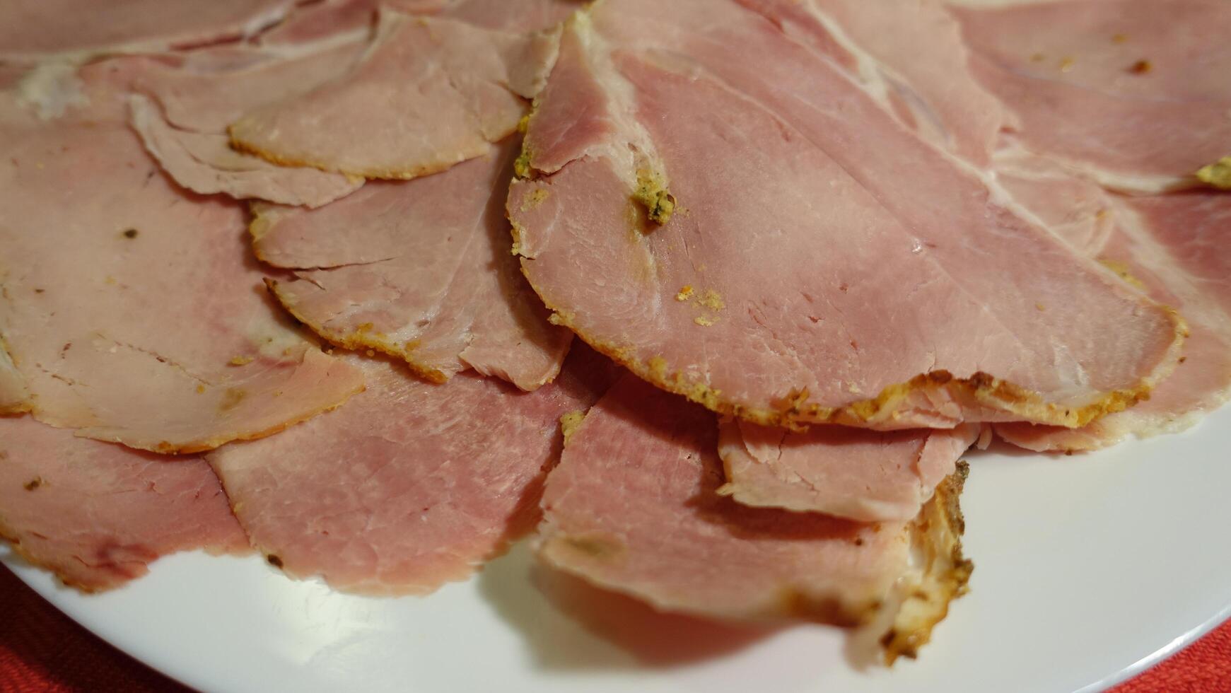 Sliced cooked pork ham with mustard photo