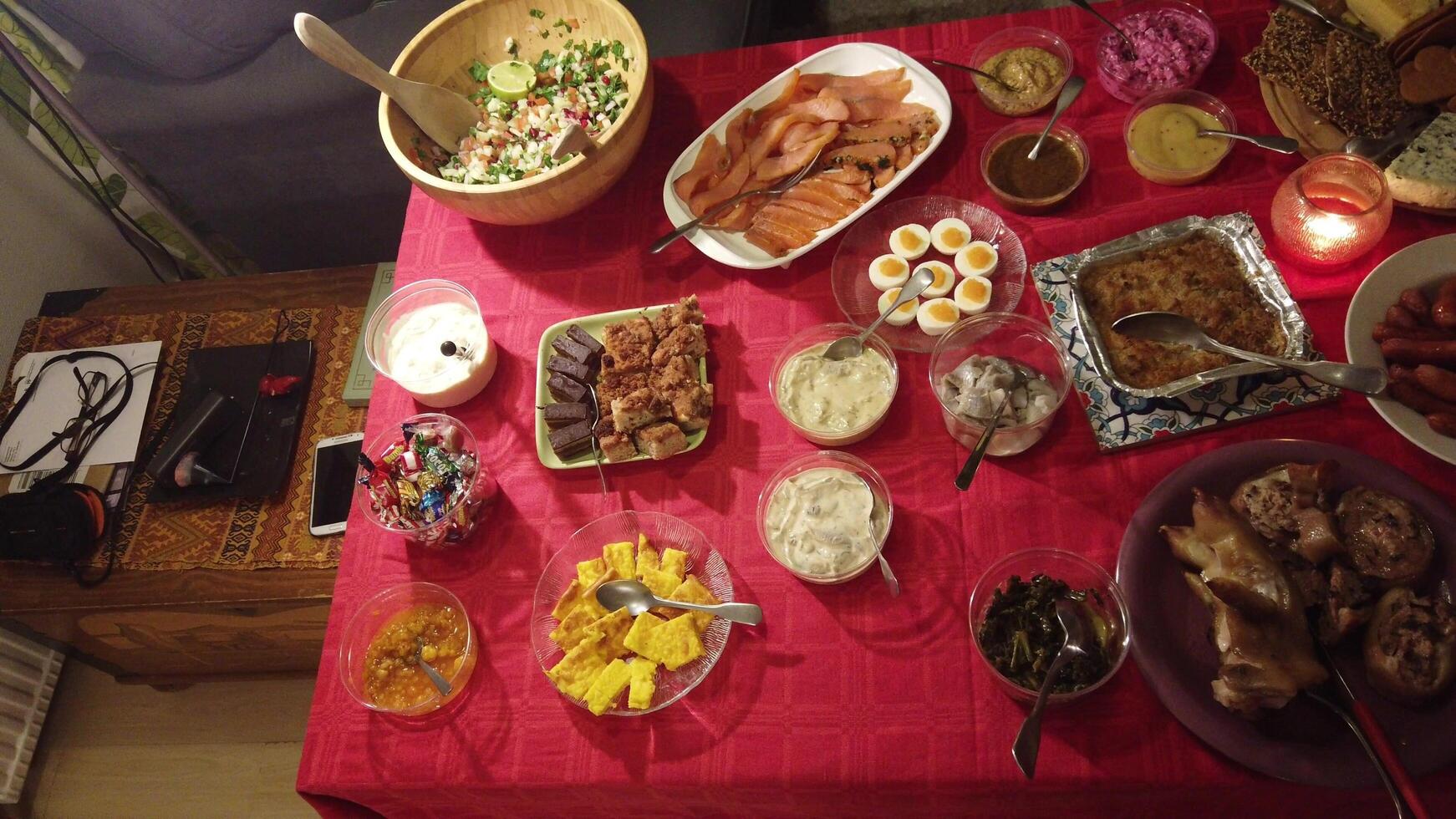 video of a traditional buffet with meat, fish, salads, cold cuts and desserts photo