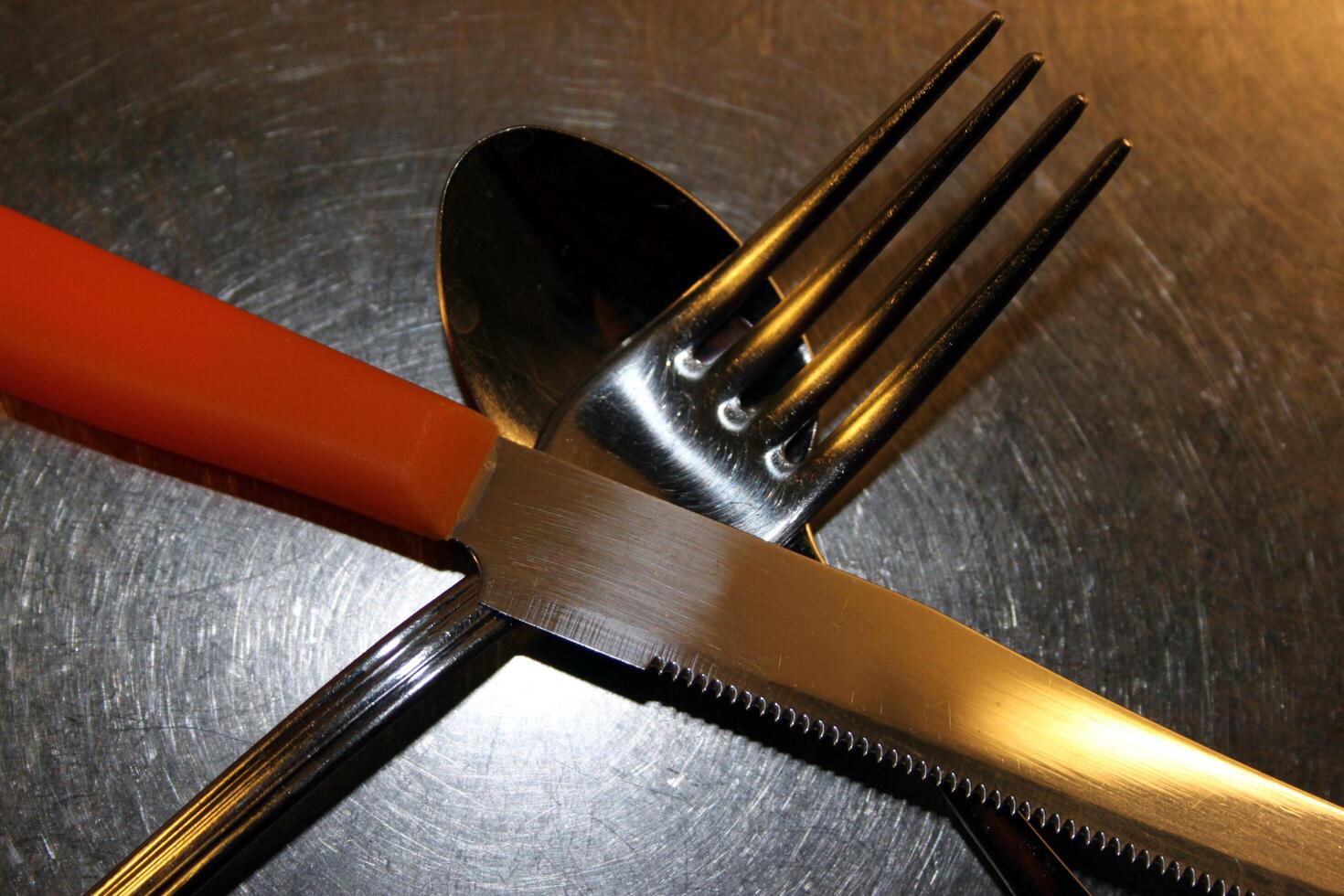 cross cutlery ready for use, spoon fork and knife photo