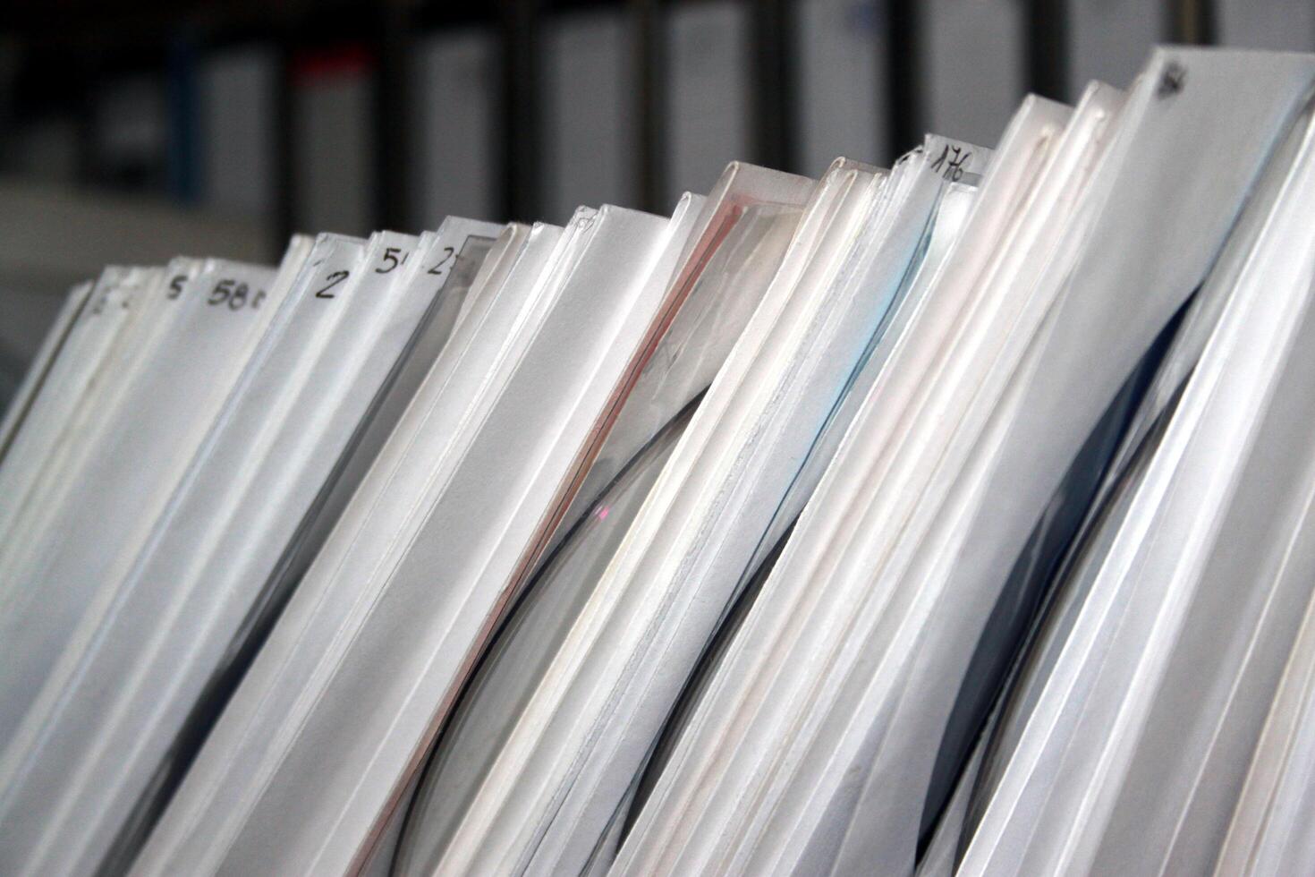 a part of a collection of numbered CDs on the shelving photo