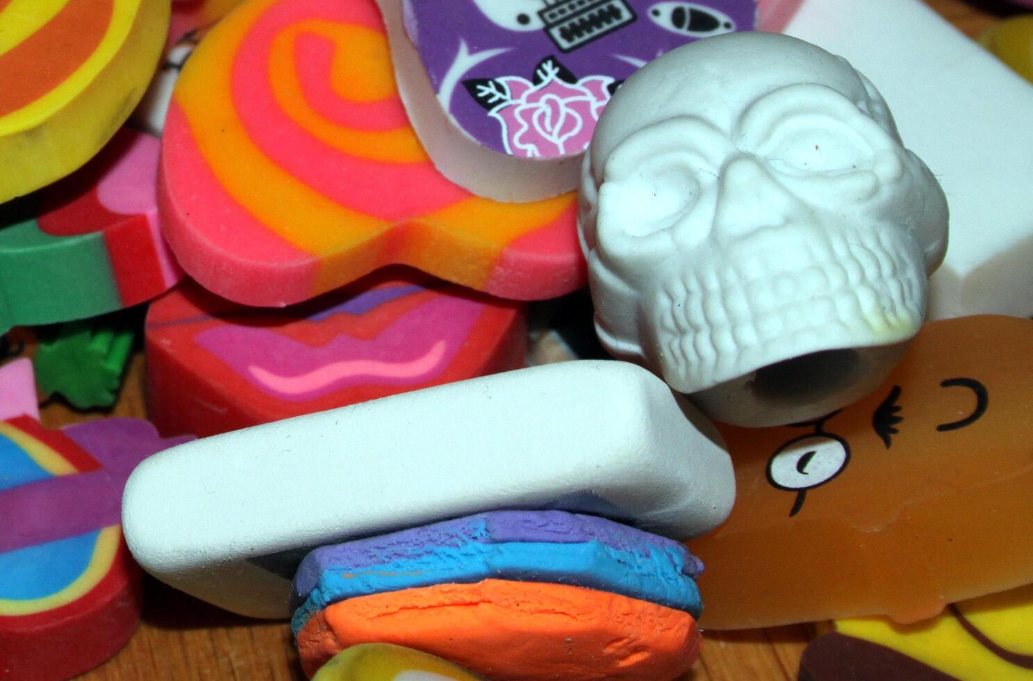 a small collection of colored erasers photo