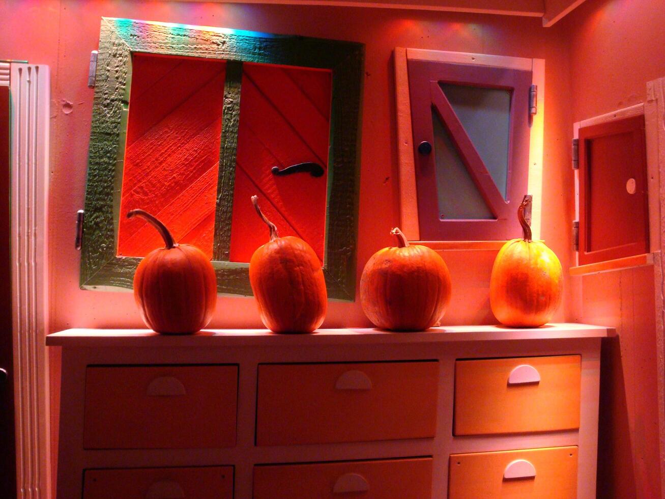 Colorful abstract doors and pumpkins during the Halloween period. photo