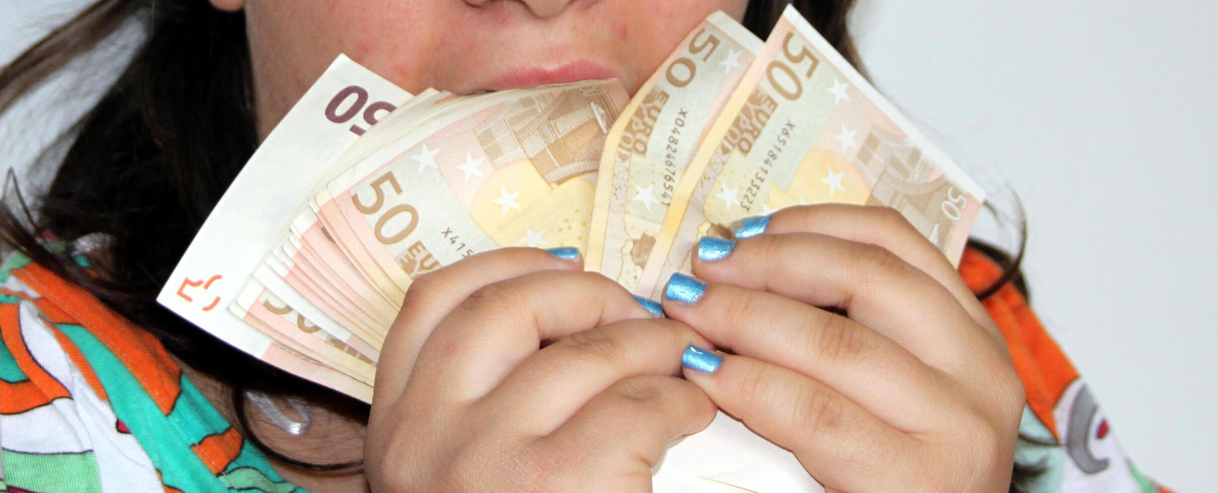 lots of euro money held by a hand like a fan photo
