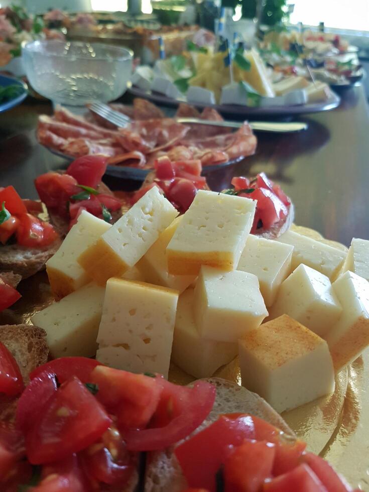 Sheep's cheese cut into cubes at a buffet photo