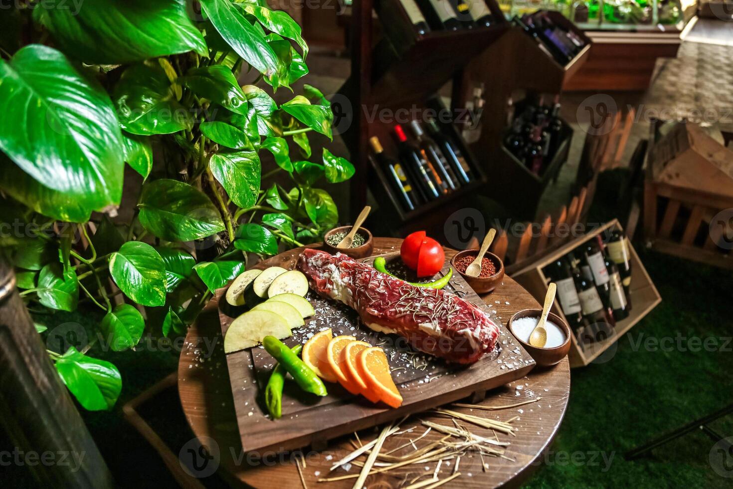 Wooden Cutting Board With Freshly Prepared Meat and Vegetables photo