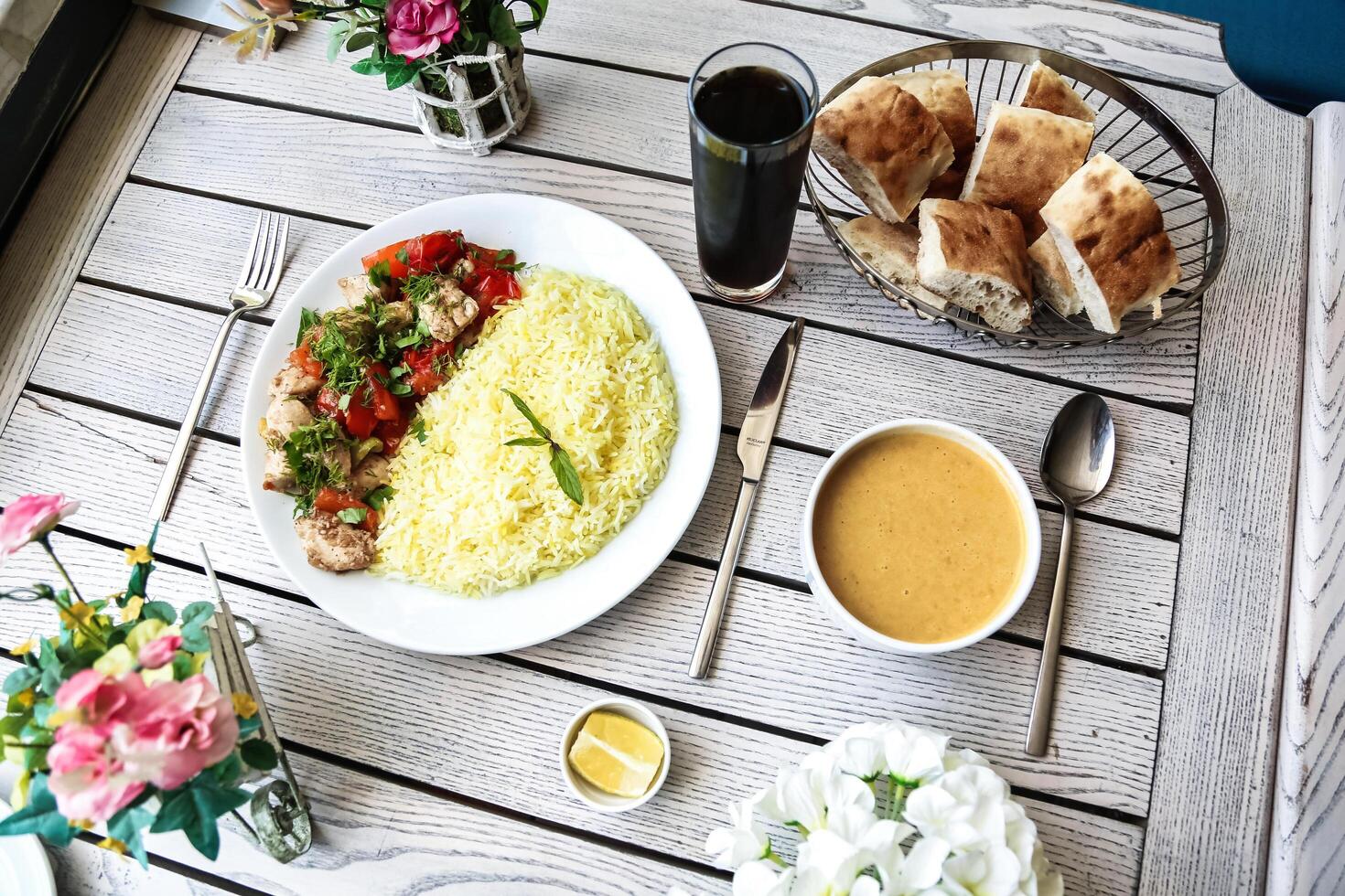 Plate of Food and Bowl of Soup on Table photo