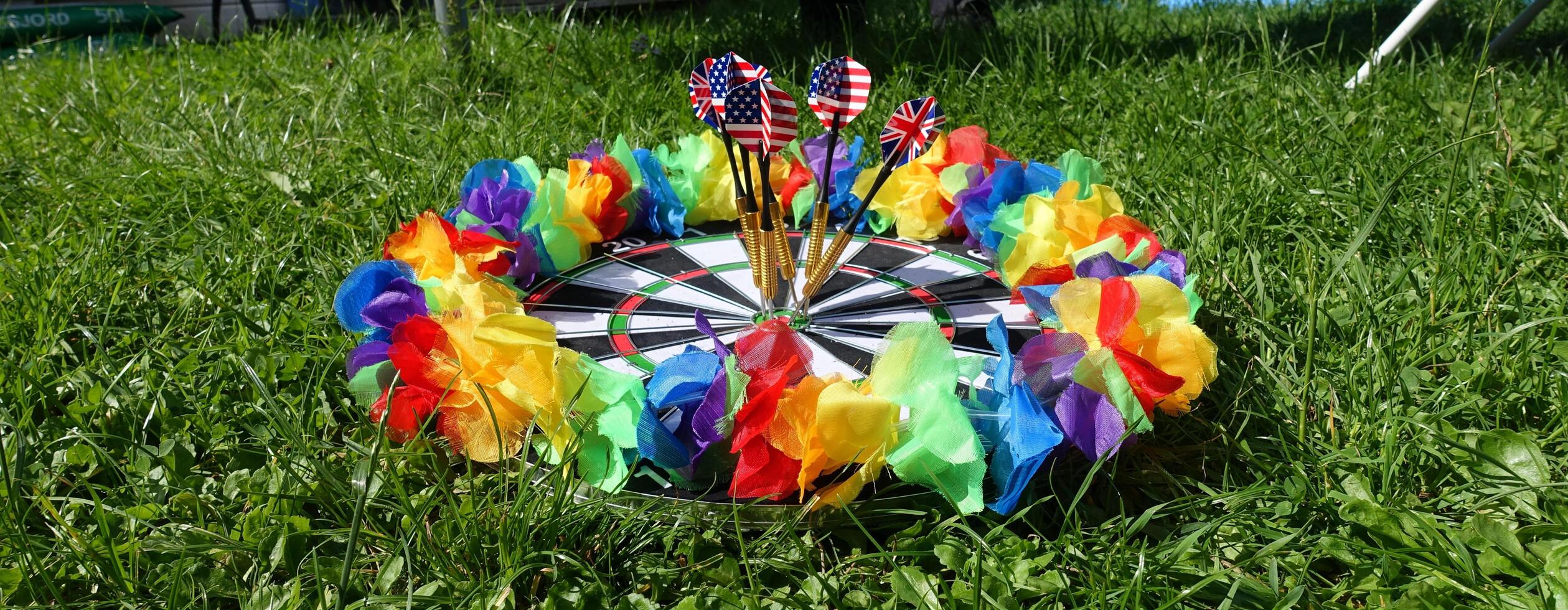 dartboard with a lgbt colored garland around it photo