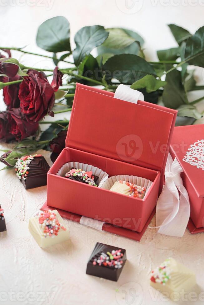 Assorted Chocolates Overflowing in a Vibrant Red Box photo