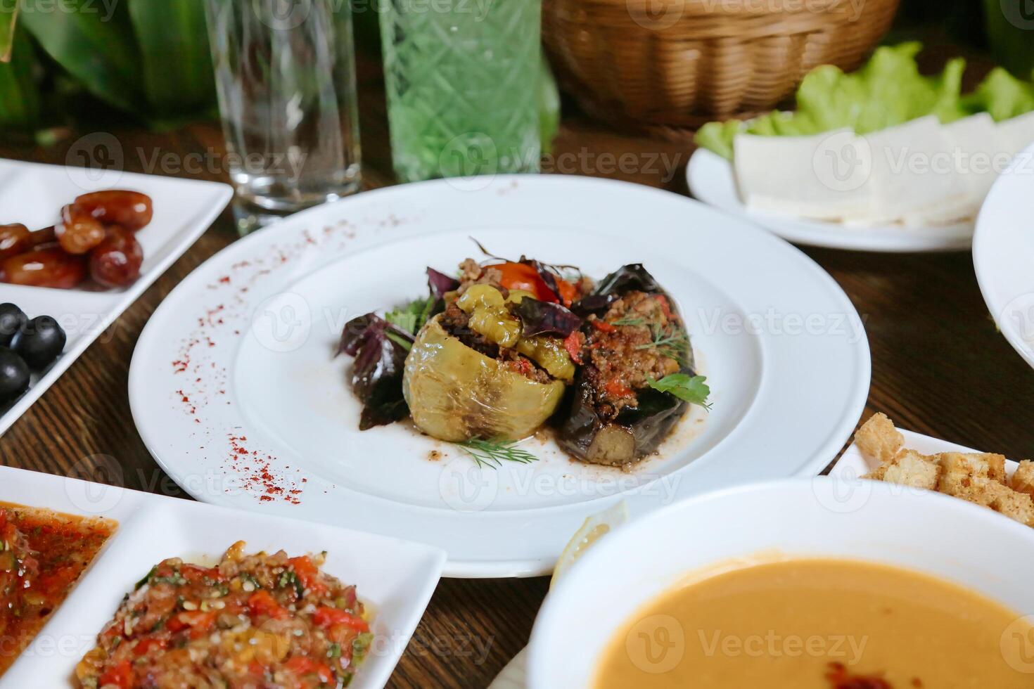 Table Adorned With Plates of Food and Bowls of Sauce photo