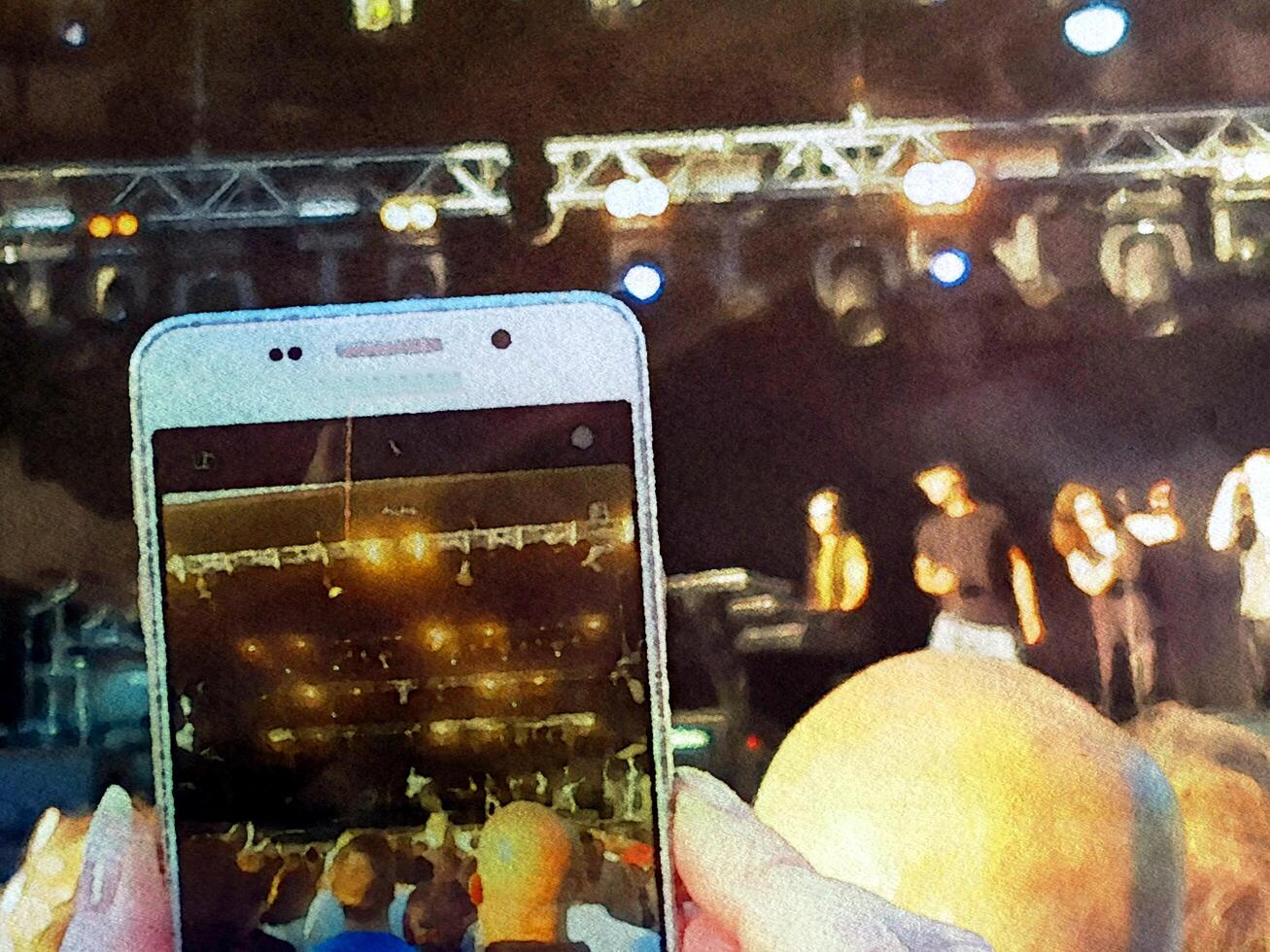 Shooting a concert with a mobile phone. Digital watercolor style. photo