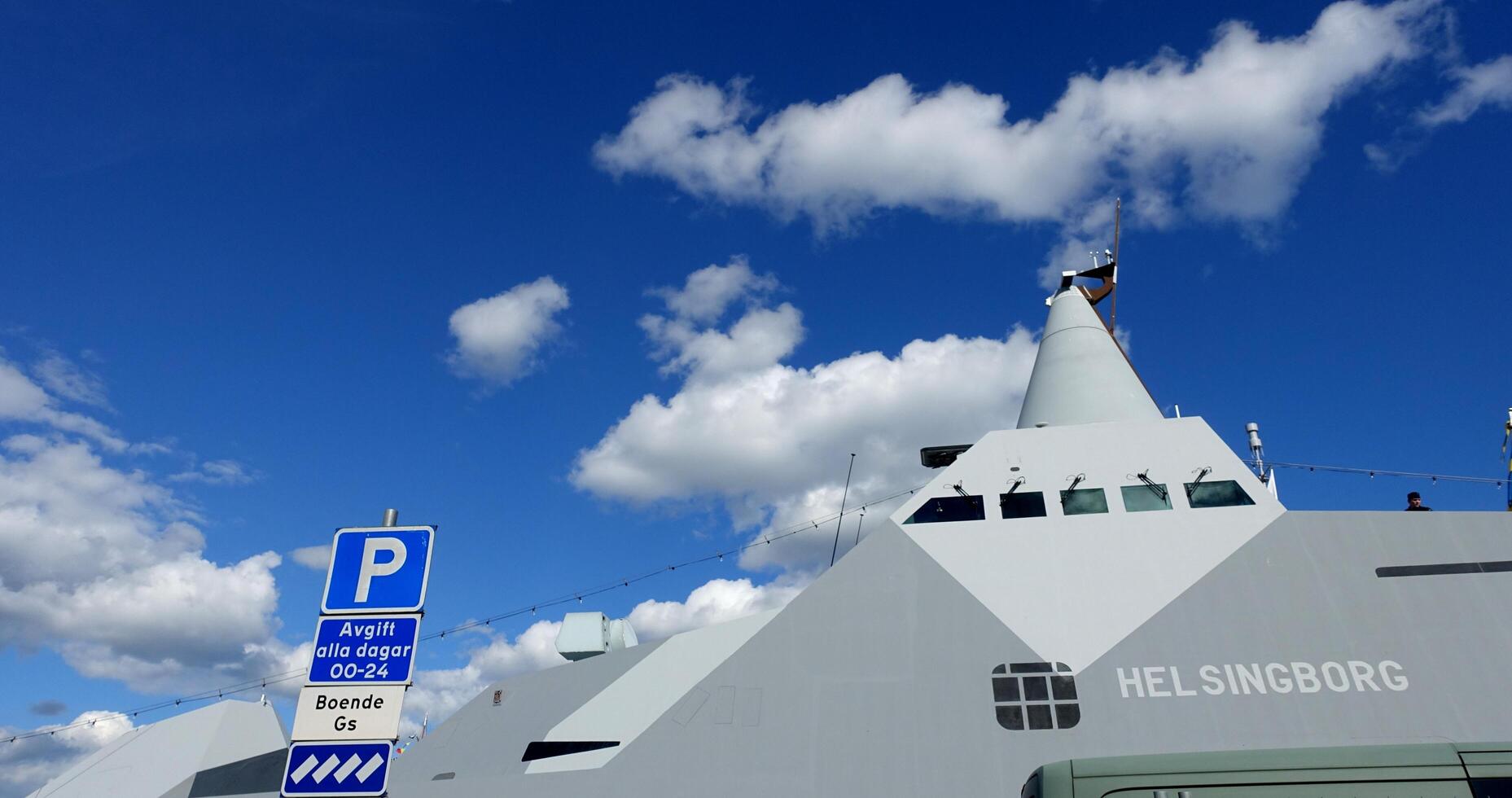 Stockholm, Sweden, June 4, 2022 a glimpse of a battleship docked at the pier. photo