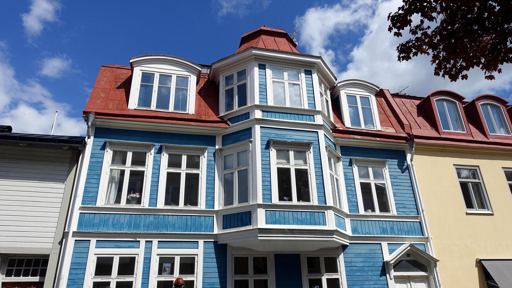 Colorful wooden buildings in the Stockholm region of Sweden. photo