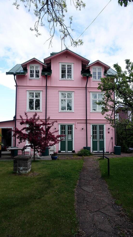 A pink painted house in the Stockholm region of Sweden. photo