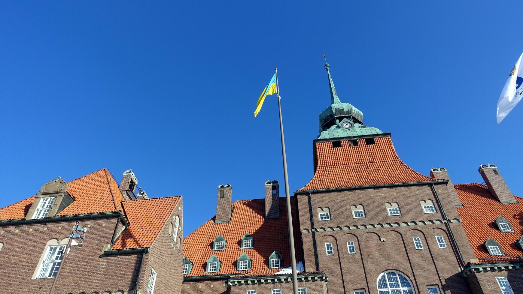 Ostersund, Sweden, March 13, 2022 The impressive historic town hall building displaying the Ukrainian flag. photo