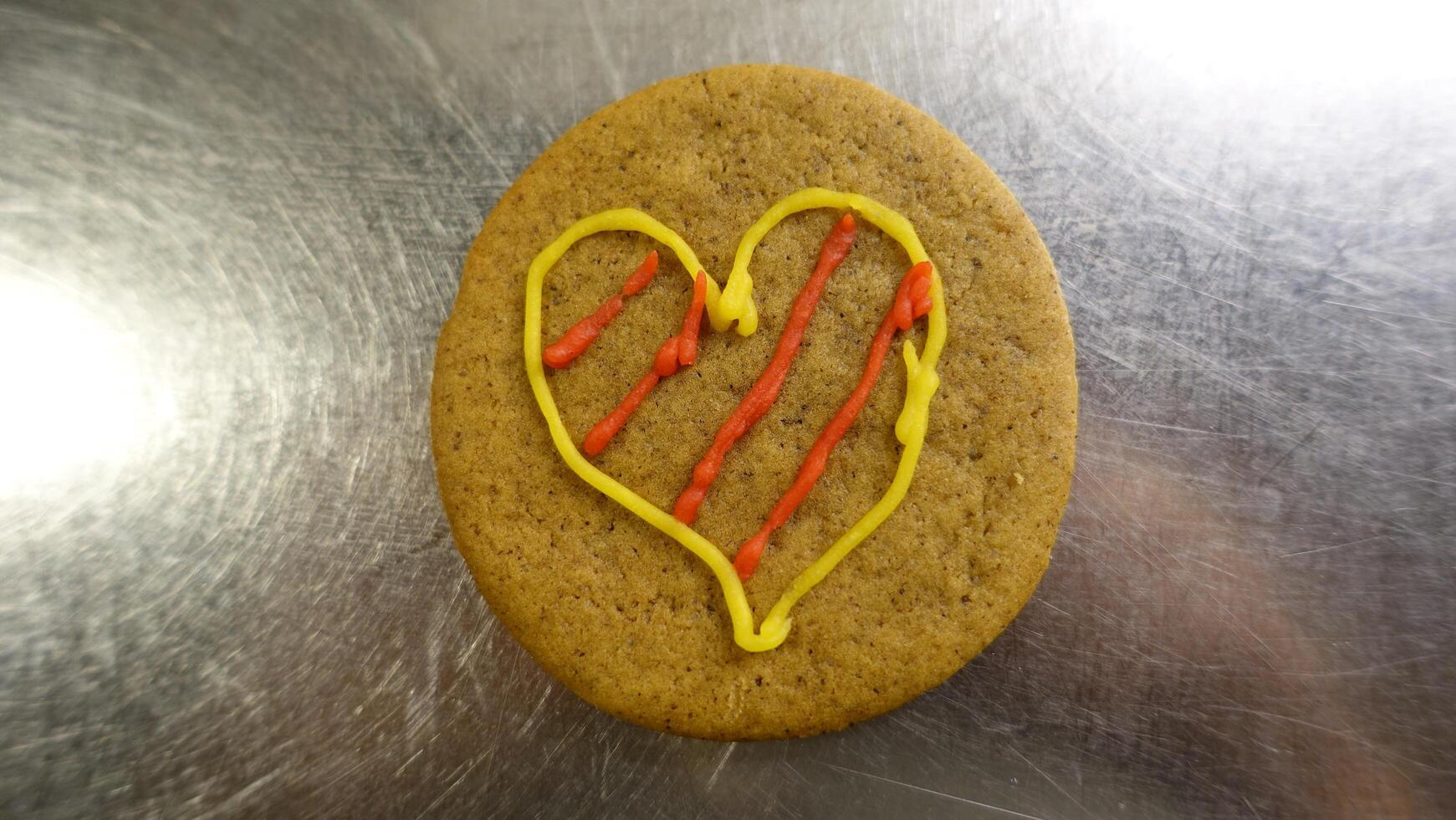 Ginger cookie decorated with a colorful heart photo